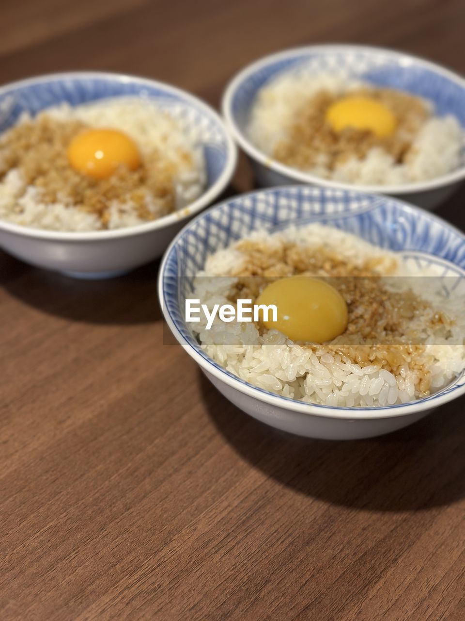 food and drink, food, dish, egg, bowl, healthy eating, wellbeing, breakfast, meal, indoors, freshness, no people, egg yolk, table, produce, asian food, wood, close-up, steamed rice, cuisine, high angle view, focus on foreground