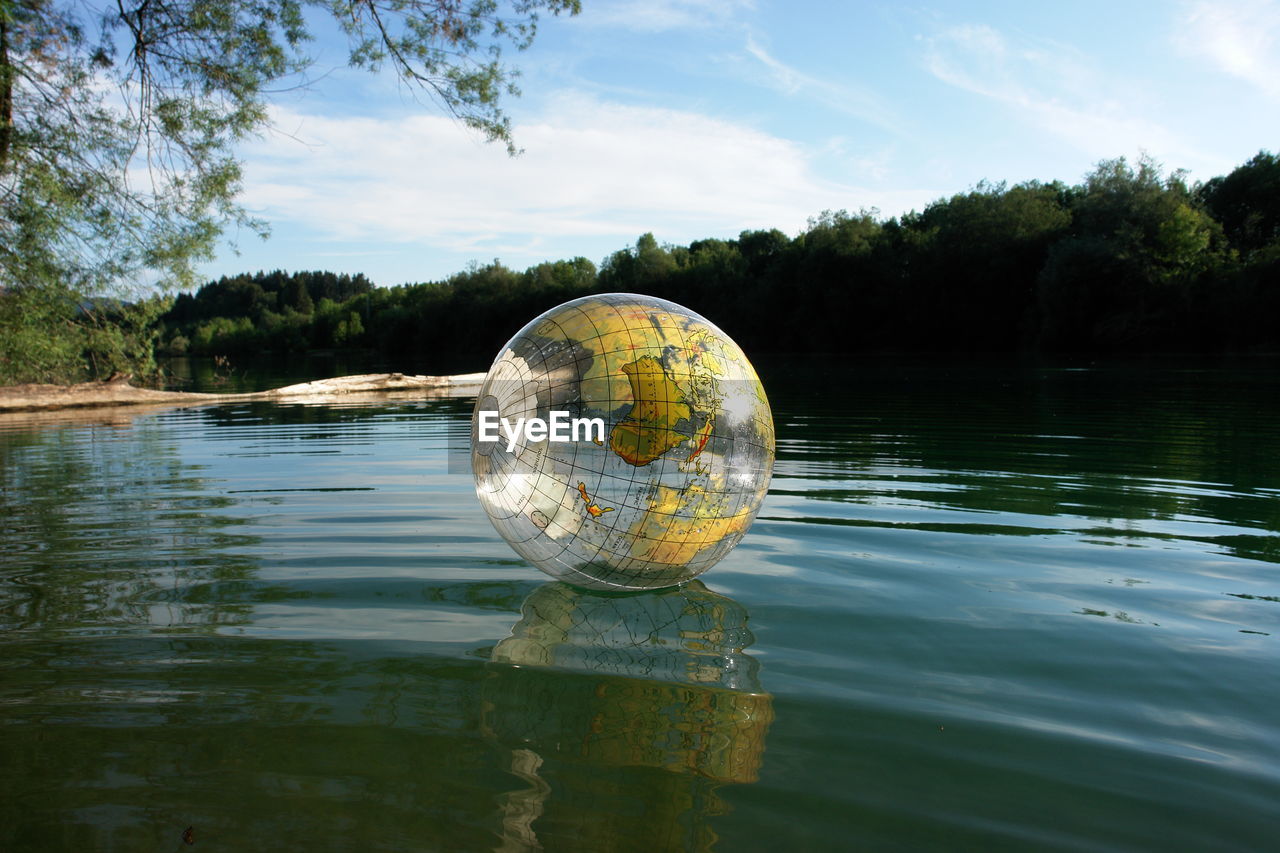close-up of crystal ball in lake