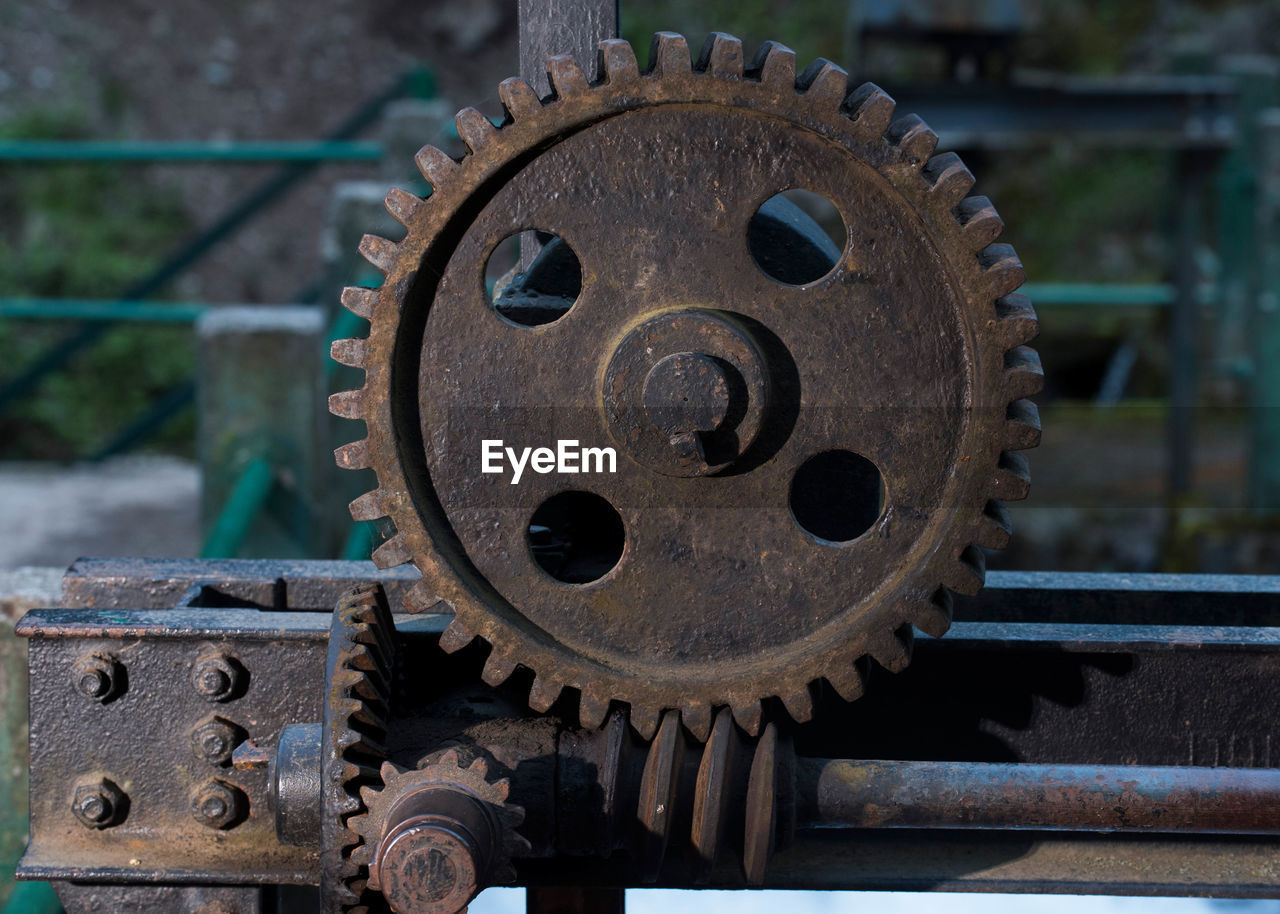 A big gear or cog wheel in a mechanical machine