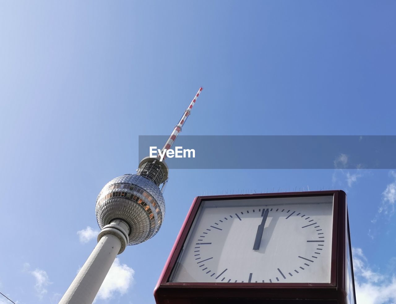 LOW ANGLE VIEW OF CLOCK TOWER AGAINST BUILDING