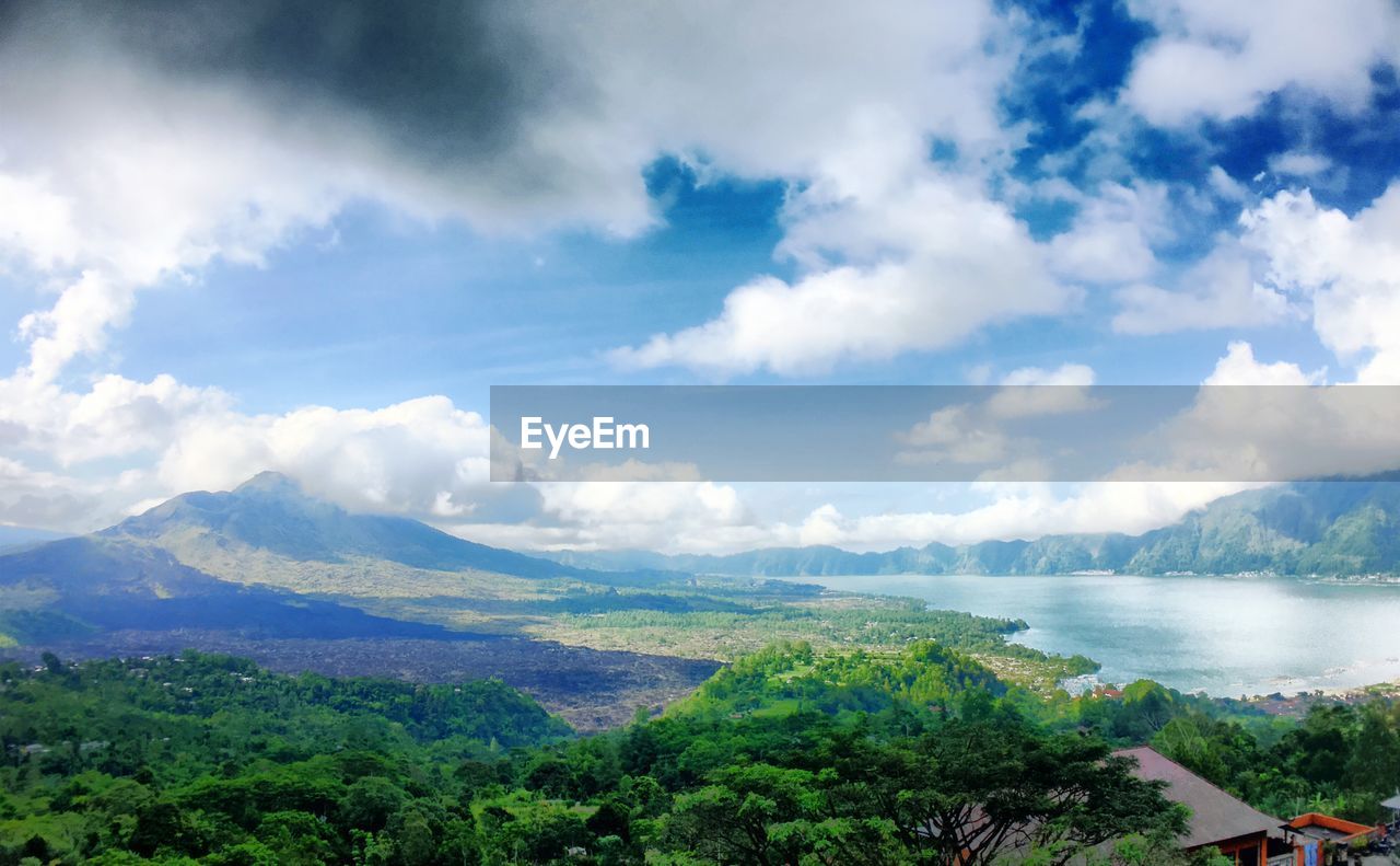 Scenic view of mountains against cloudy sky