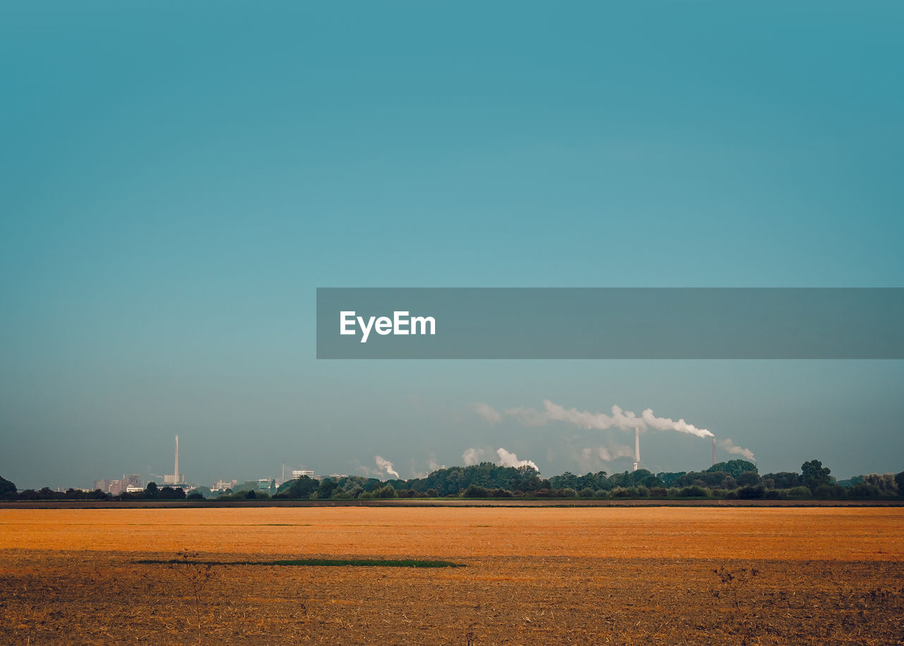 AGRICULTURAL FIELD AGAINST CLEAR SKY