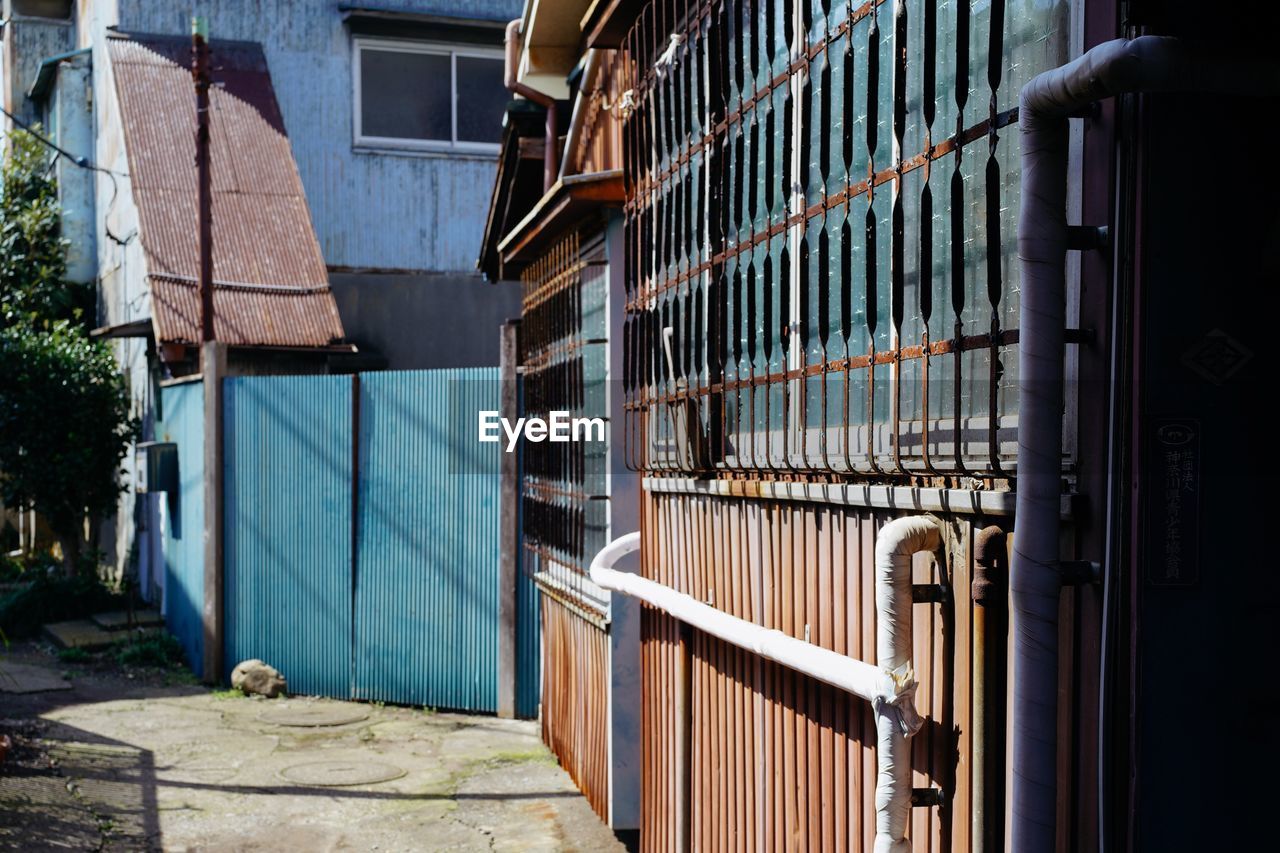 BUILDINGS SEEN THROUGH FENCE