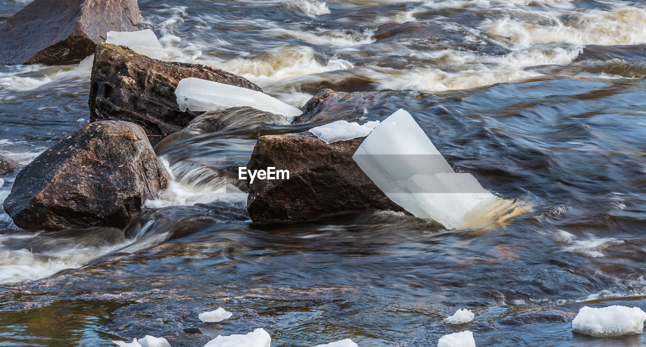 WATER FLOWING FROM ROCKS