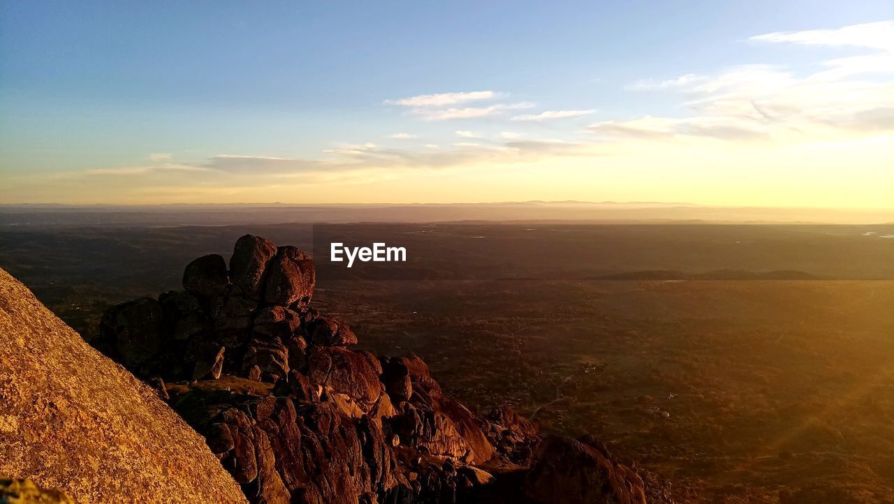 SCENIC VIEW OF SUNSET OVER LAND