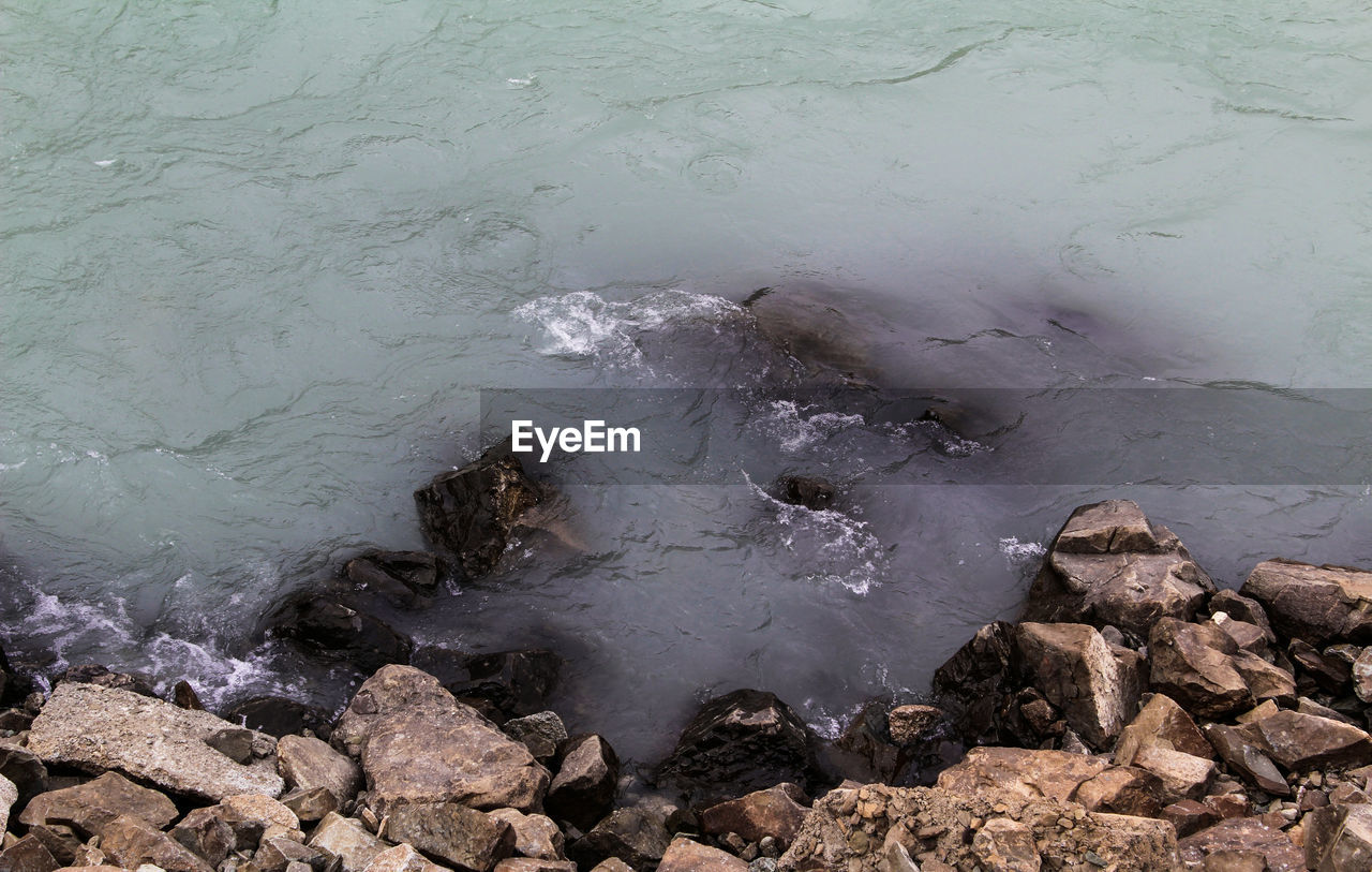 HIGH ANGLE VIEW OF SEA SHORE