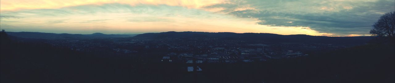 VIEW OF CITYSCAPE AT SUNSET