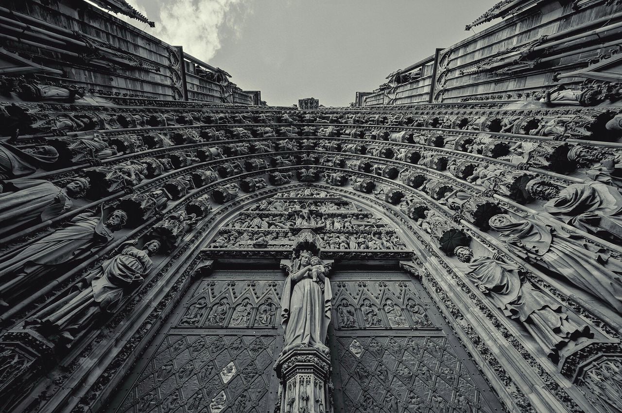 Low angle view of statues on old building