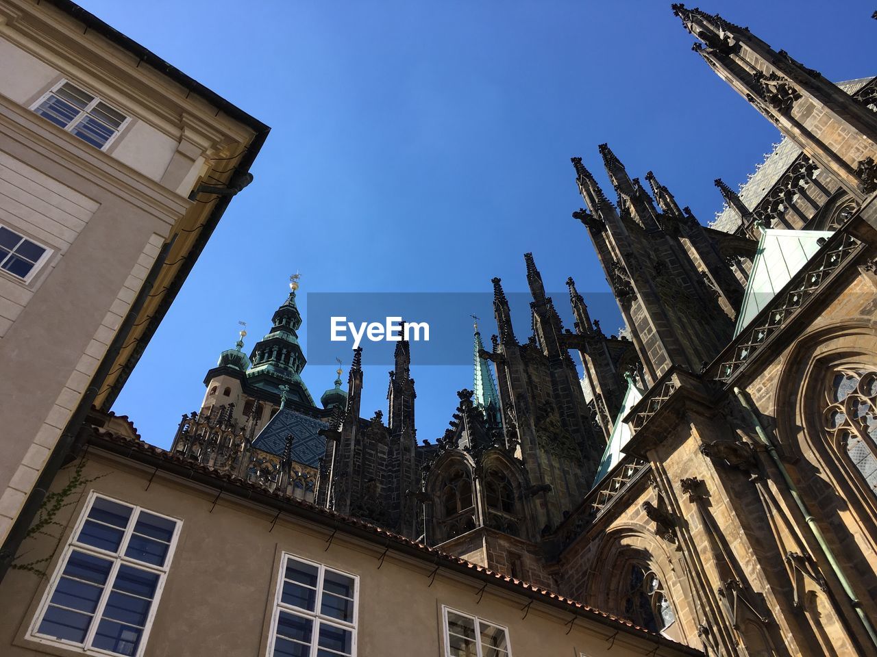 Low angle view of gothic church against blue sky