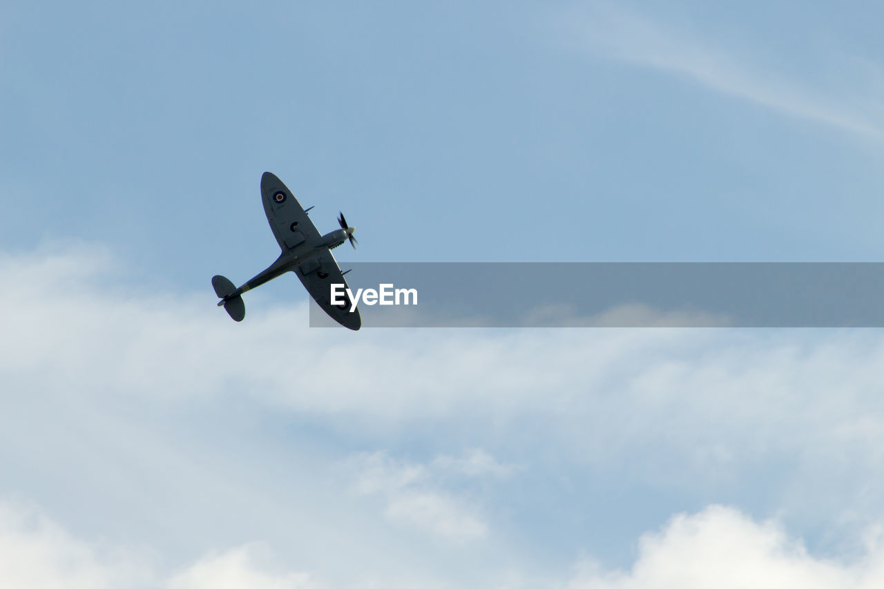 Low angle view of airplane against sky