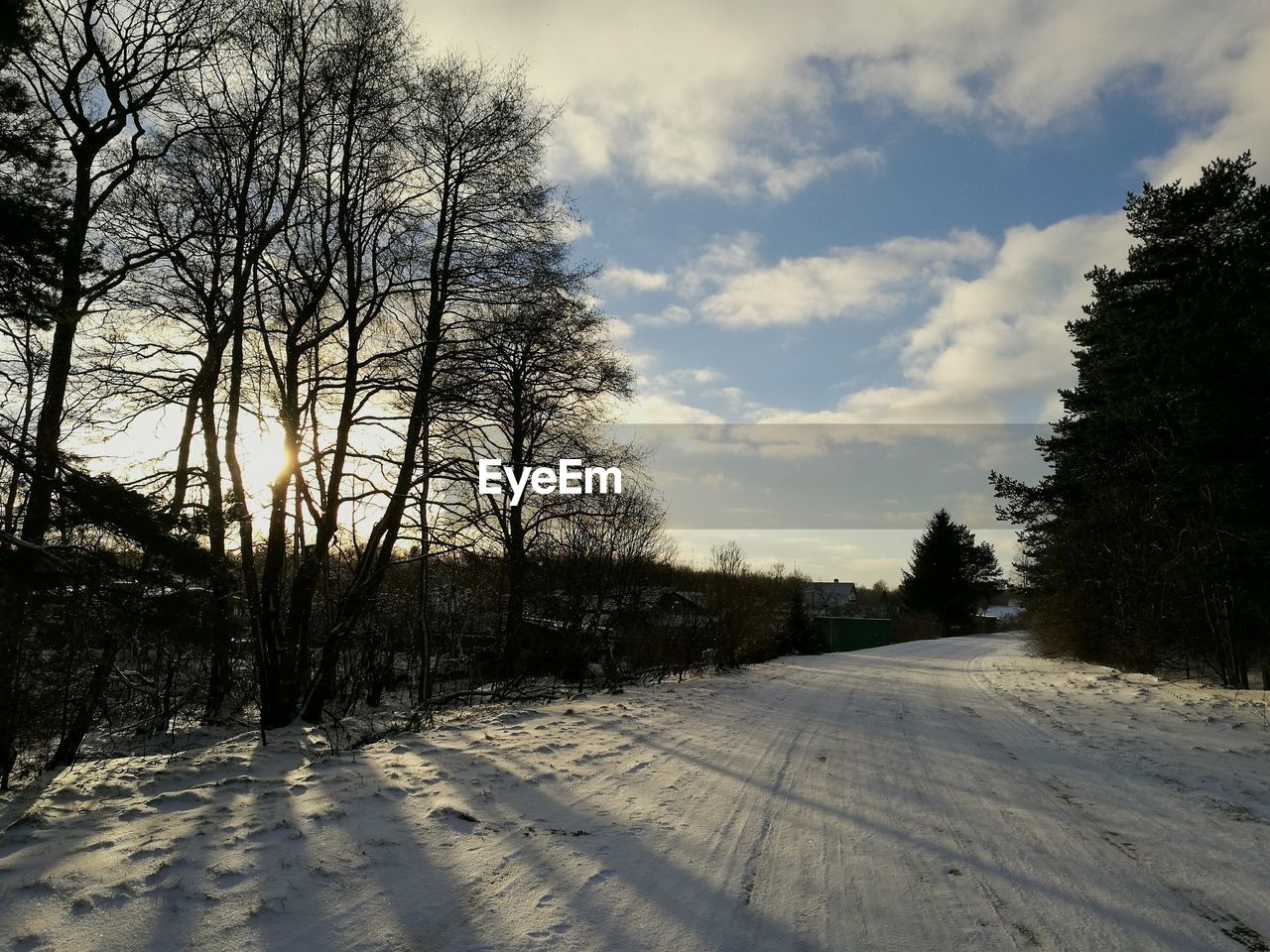 SNOW COVERED LANDSCAPE AGAINST SKY