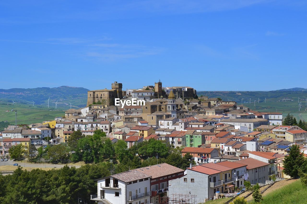 VIEW OF RESIDENTIAL DISTRICT AGAINST CLEAR BLUE SKY