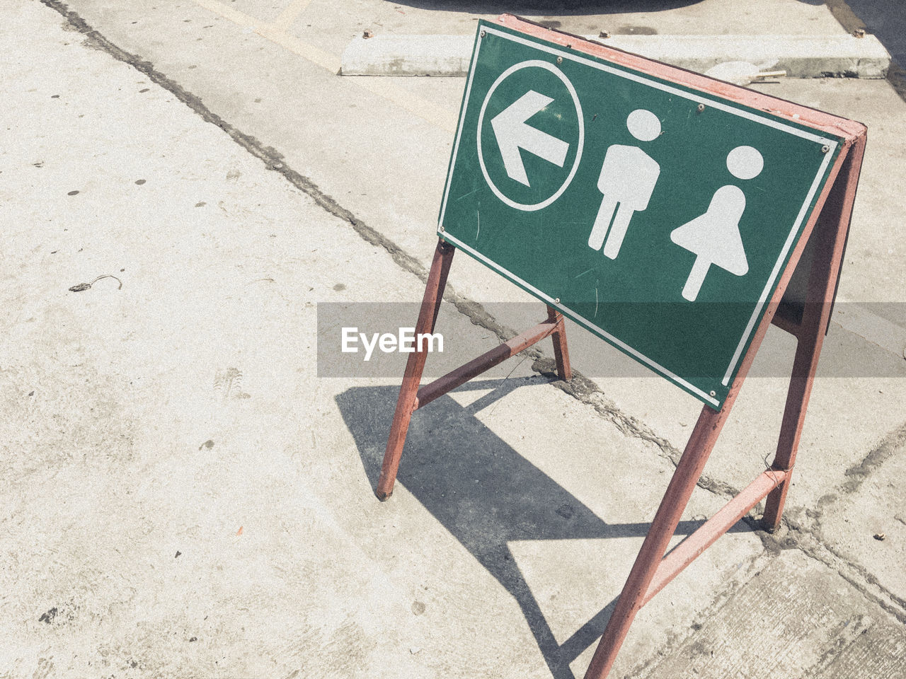 High angle view of restroom sign on street