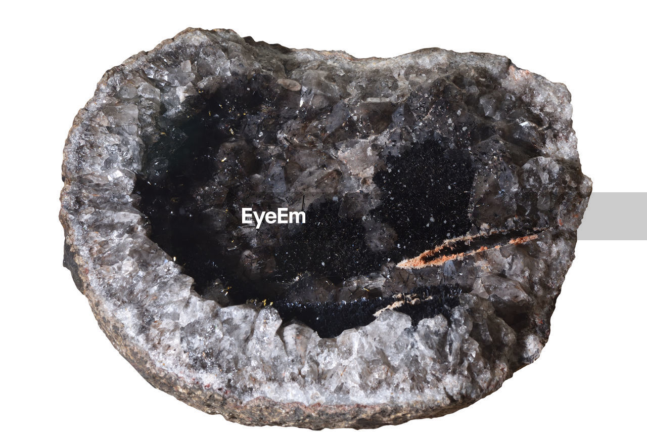 Quartz goethite gemstone, minerals isolated on a white background