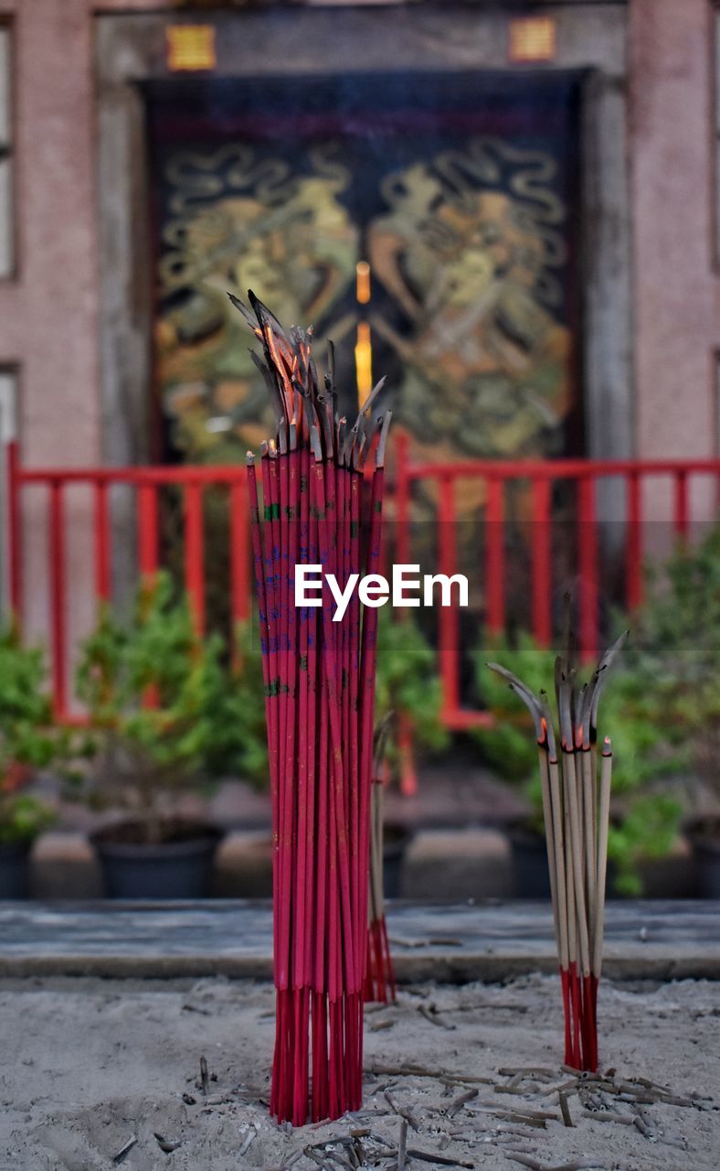 Close-up of incense burning in temple