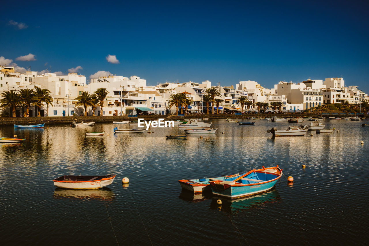 Boats in sea in arrecife, lanzerote.