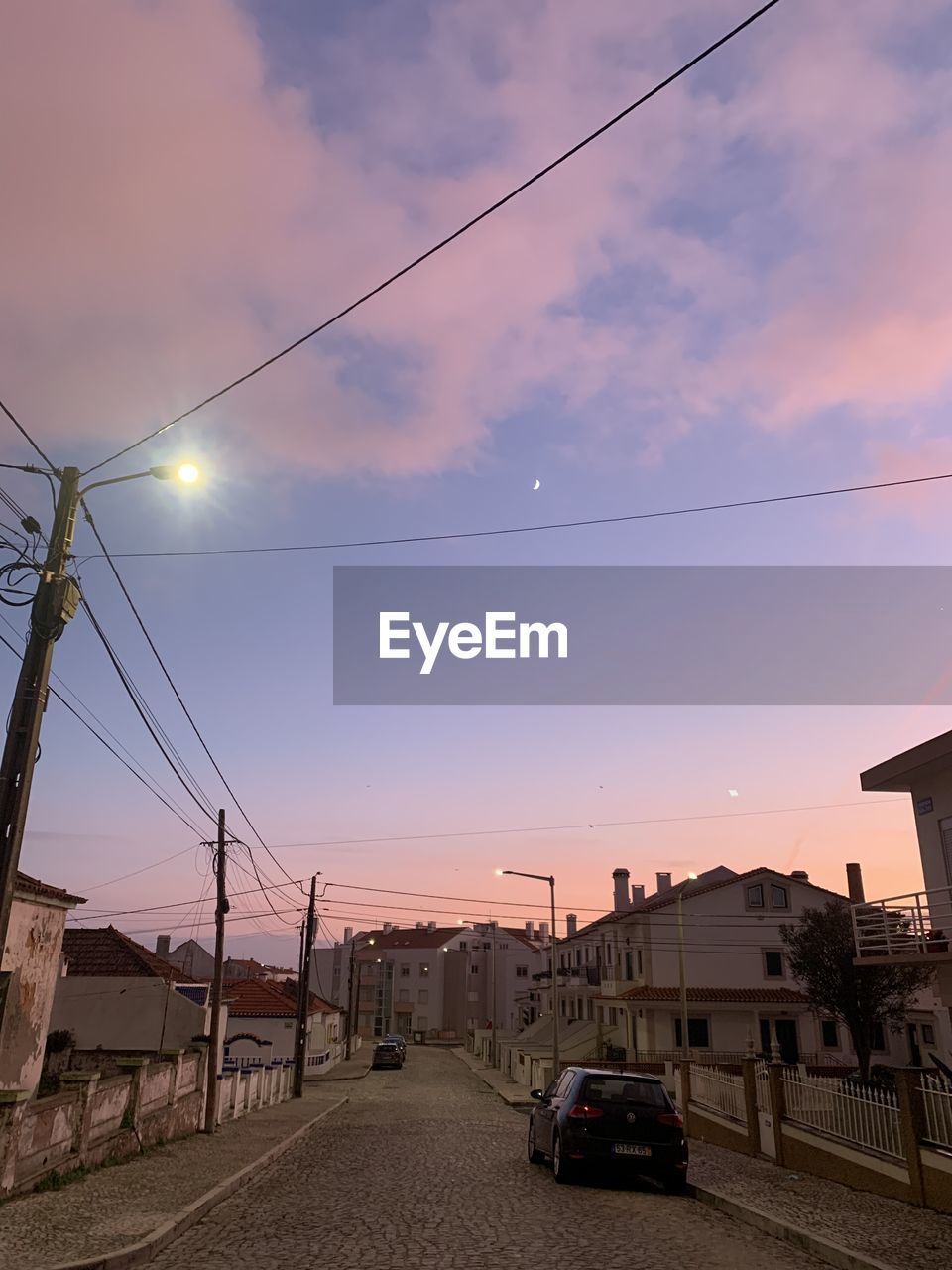 sky, architecture, cloud, nature, cable, electricity, built structure, technology, transportation, vehicle, no people, sunset, building exterior, outdoors, power generation, reflection, low angle view, evening, industry, light, business finance and industry, city, power supply, water, sunlight, nautical vessel