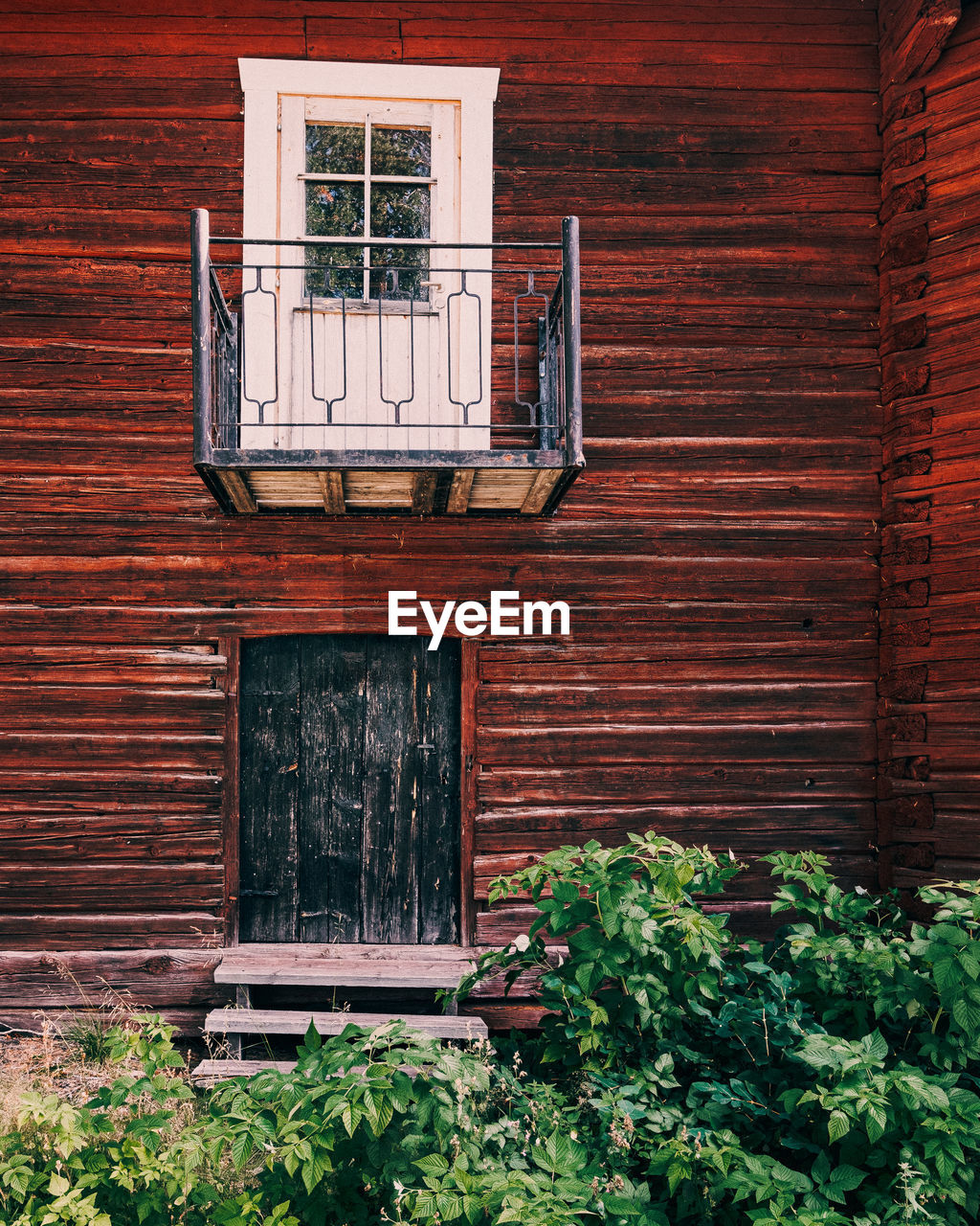 Closed door of old wooden building