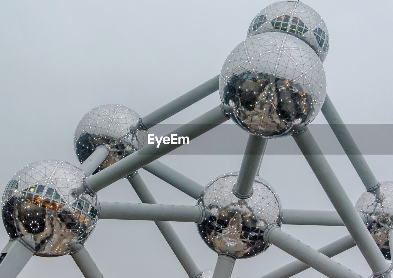 CLOSE-UP OF LIGHT BULBS AGAINST SKY