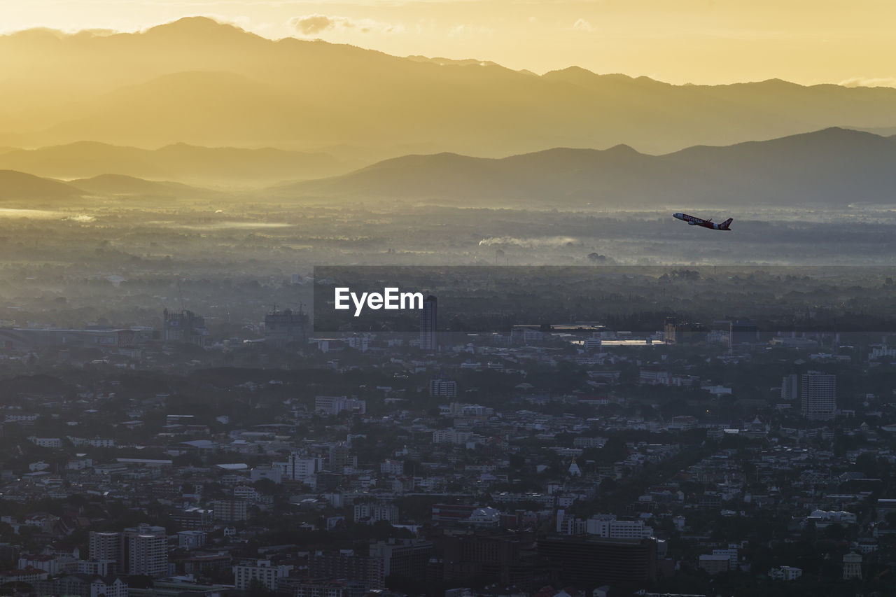 Aerial view of city at sunset