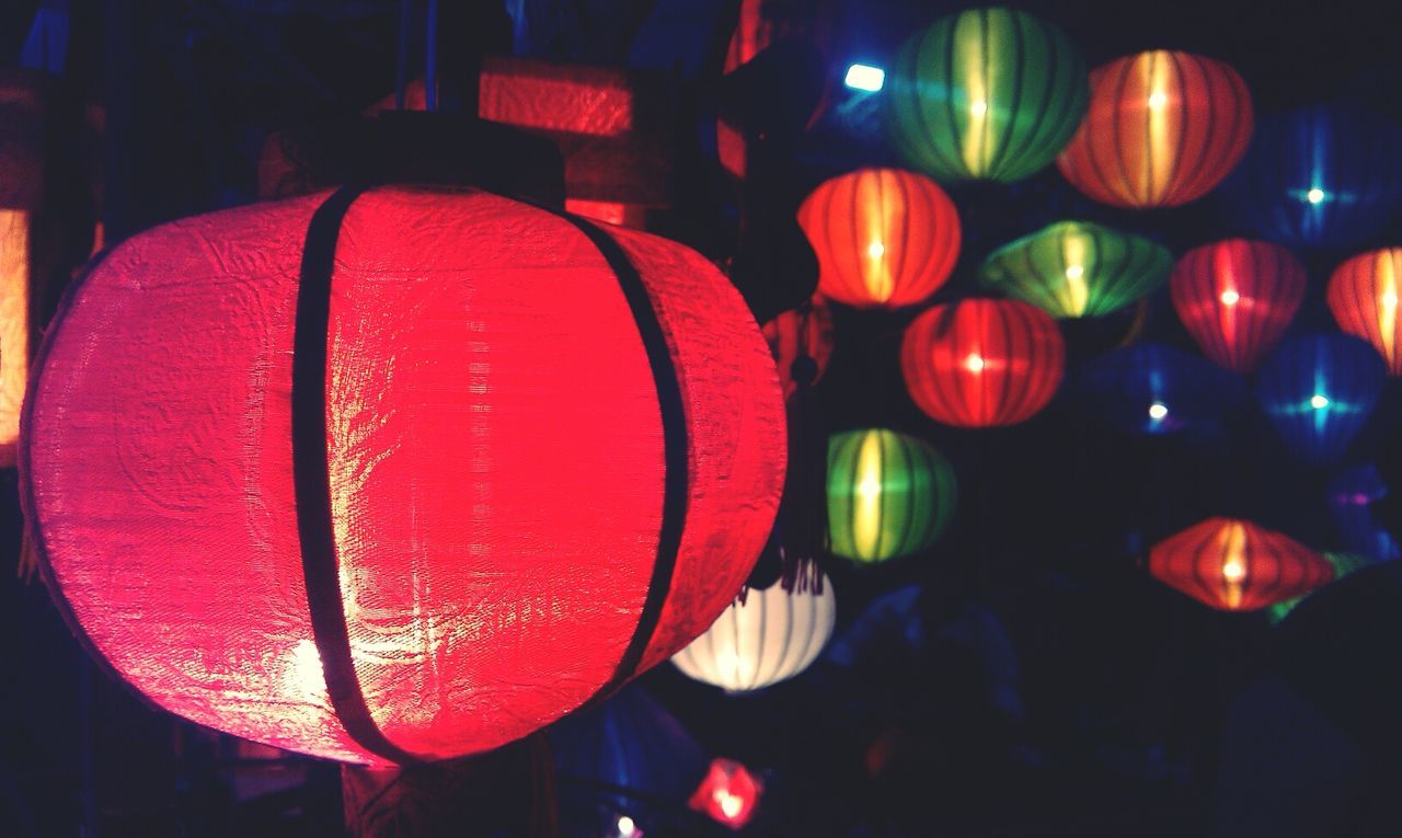 Various lanterns hanging in shop