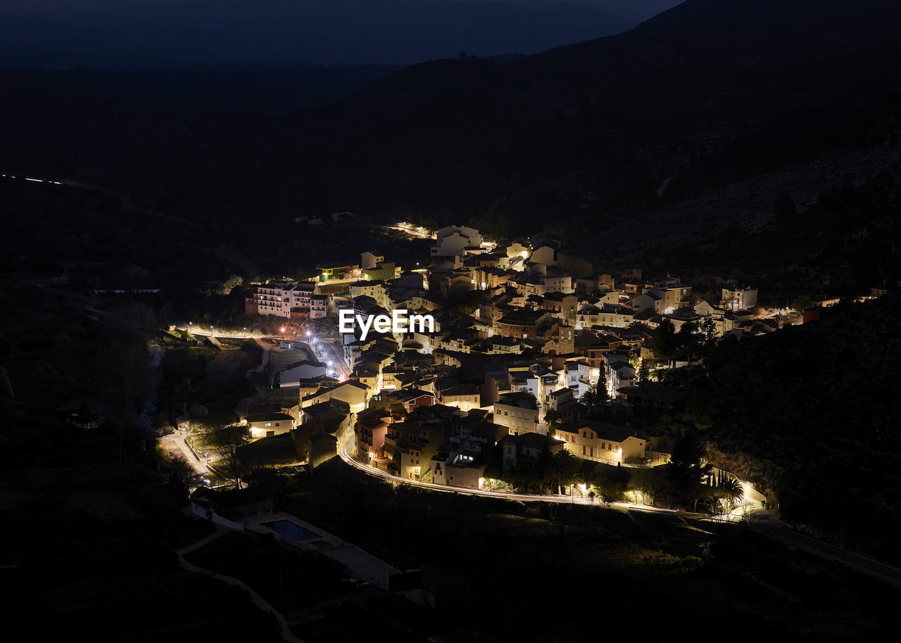 Mountain village from above, night photography, light trails, long exposure, mountain and roads