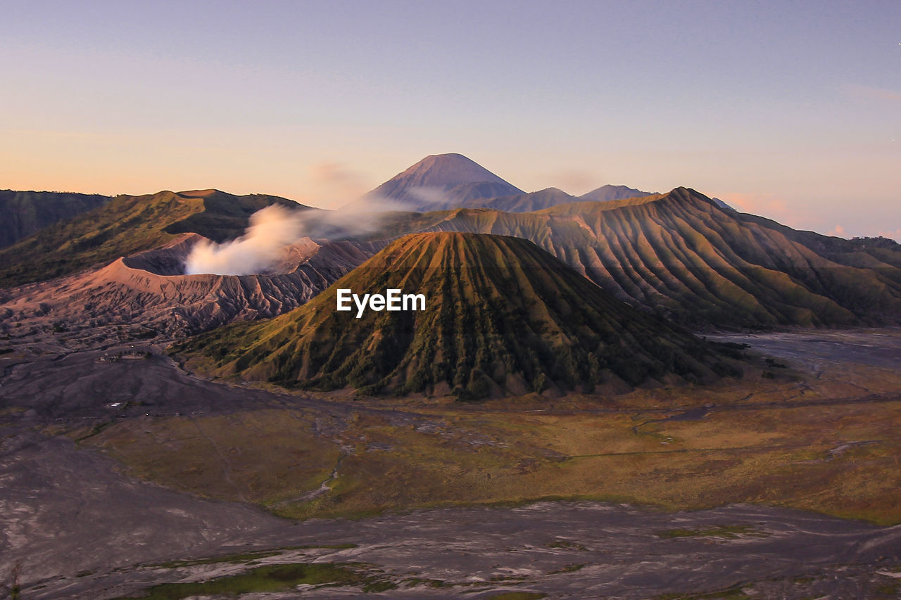 Scenic view of volcanic landscape during sunset