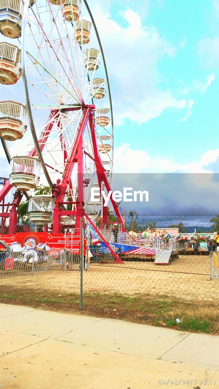 FERRIS WHEEL AGAINST THE SKY