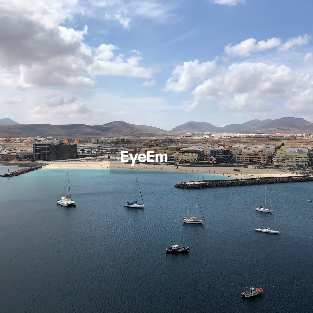 High angle view of sailboats in sea against sky