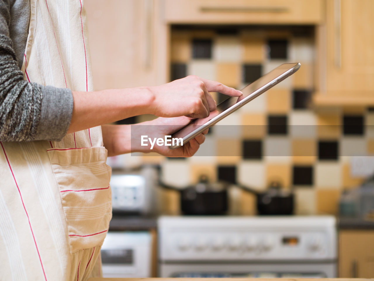 Close-up of woman using digital tablet 