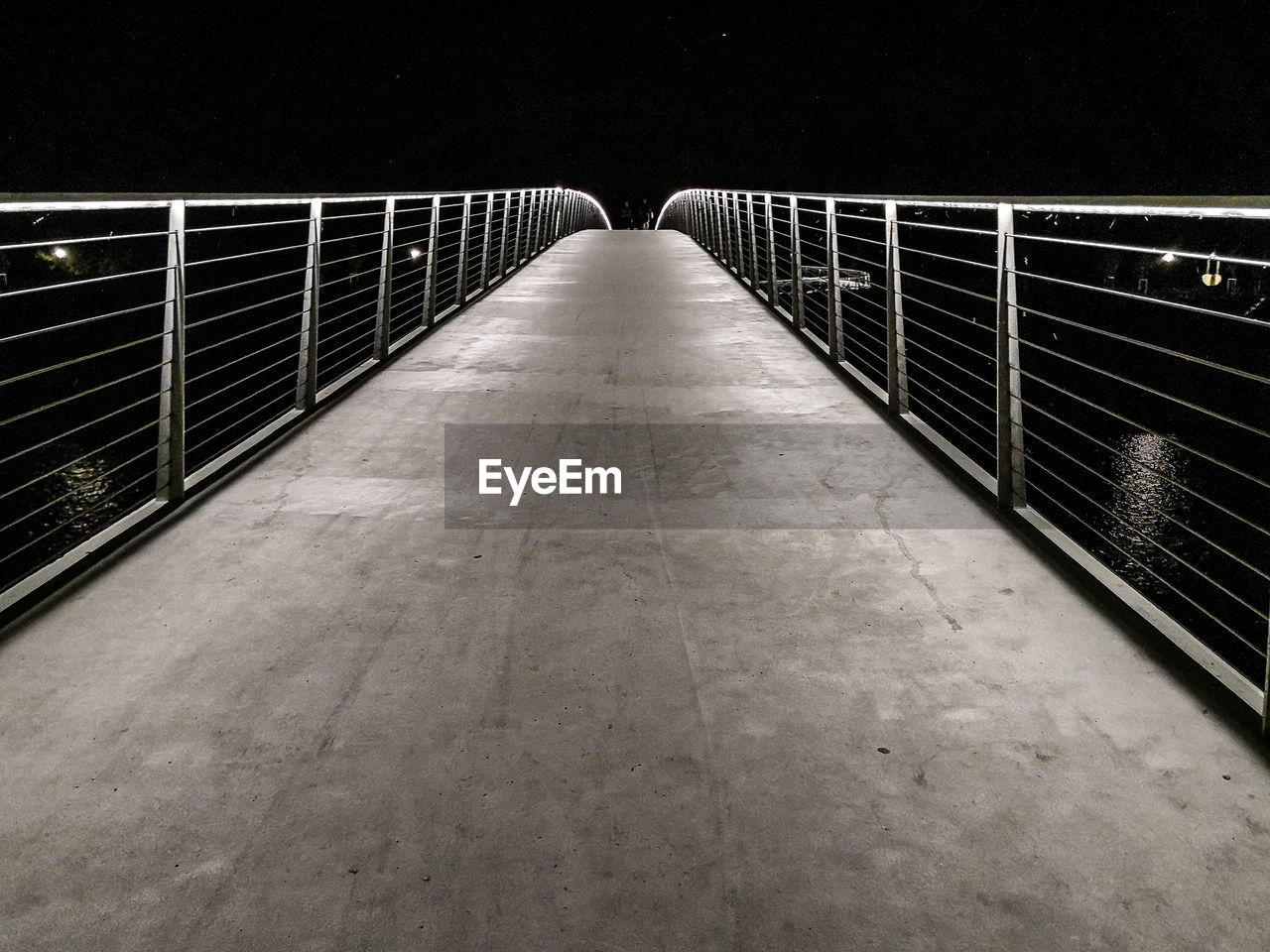 Empty footbridge at night