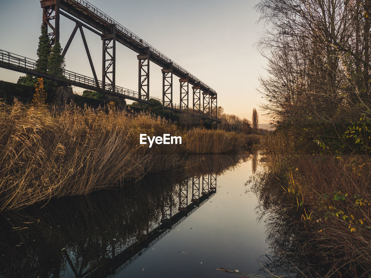 Bridge over river against sky