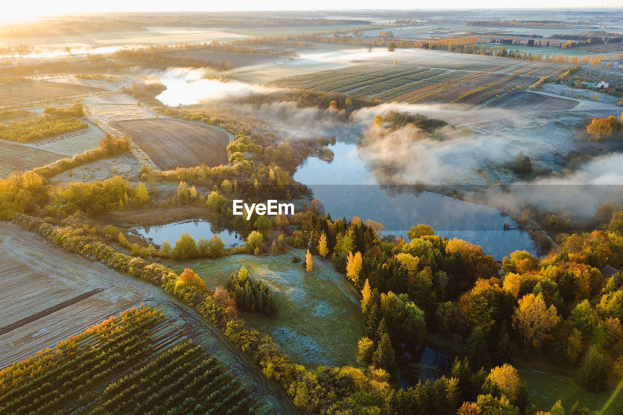 Aerial view of landscape during autumn against sky