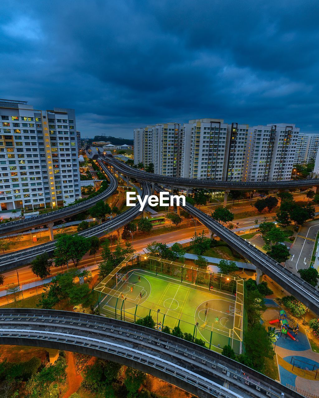 High angle view of road amidst buildings in city against sky