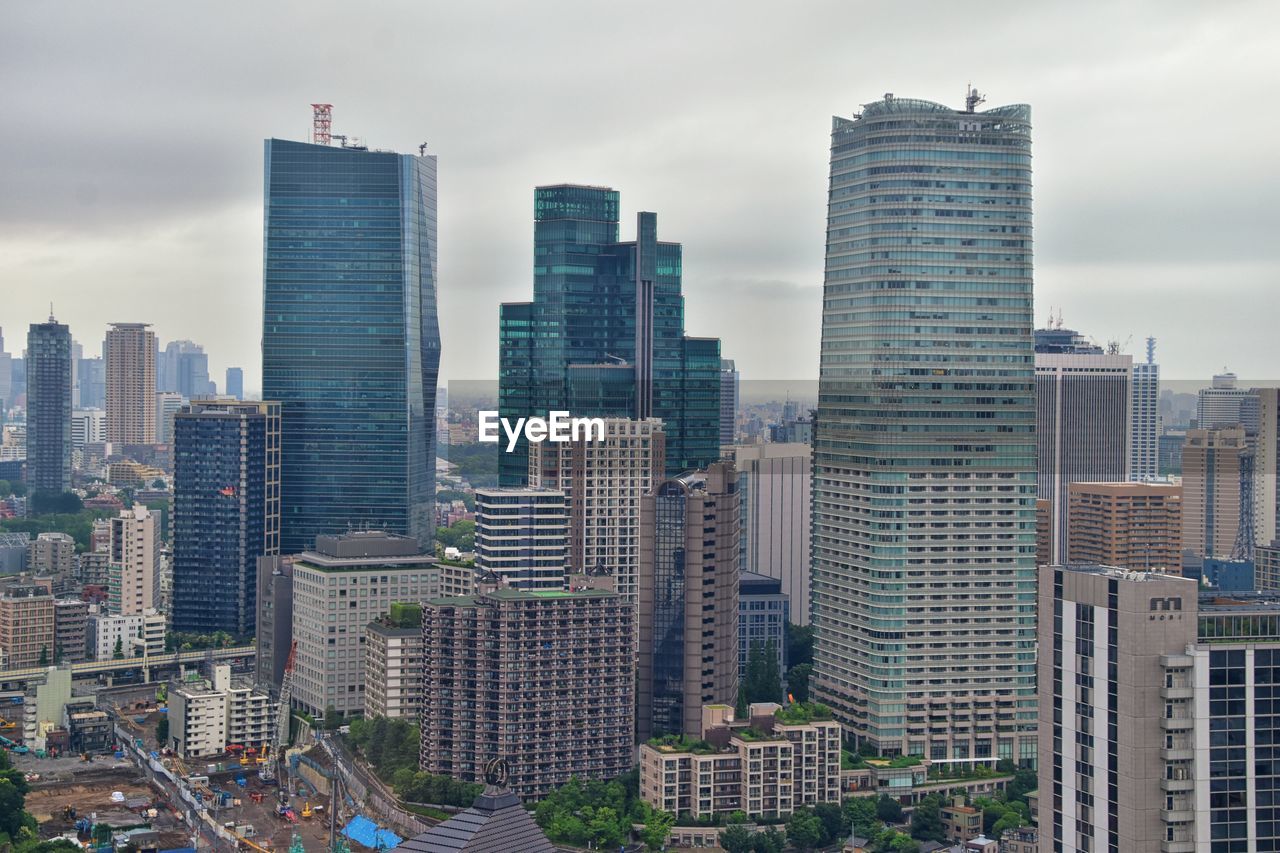 Modern buildings in city against sky