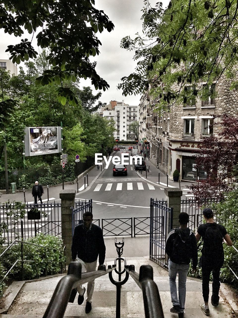 GROUP OF PEOPLE WALKING ON ROAD