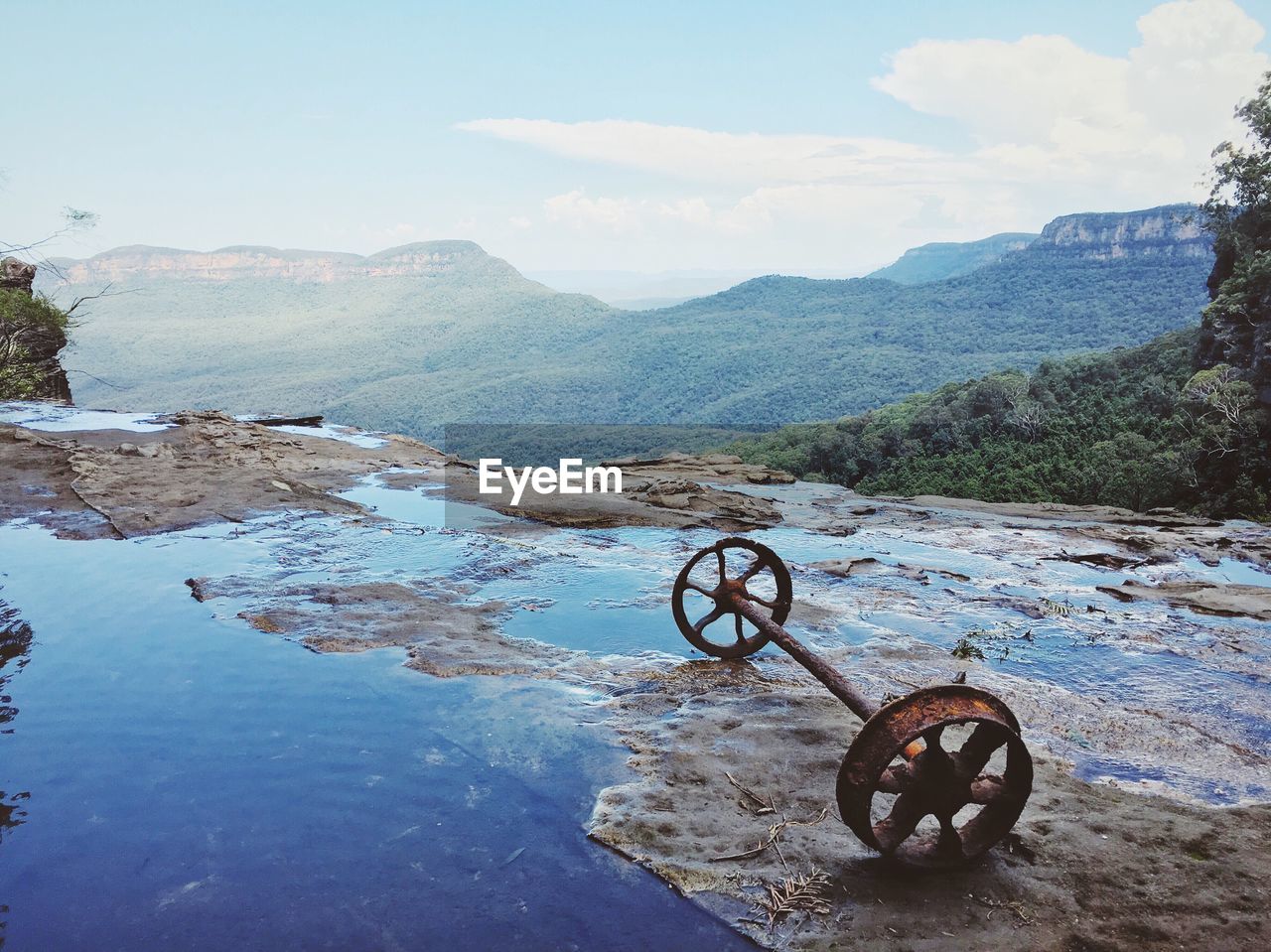 Rusty wheels by mountain range at blue mountains national park
