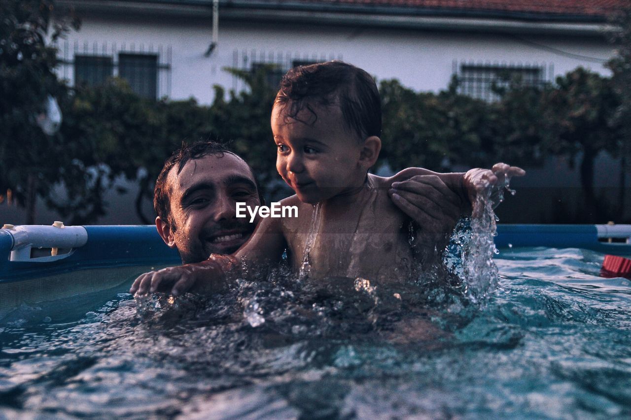 HIGH ANGLE VIEW OF YOUNG WOMAN IN WATER