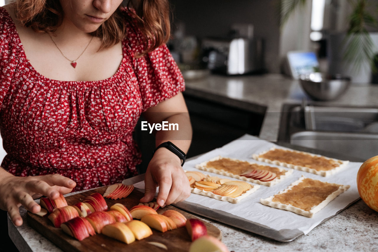 Midsection of woman holding food