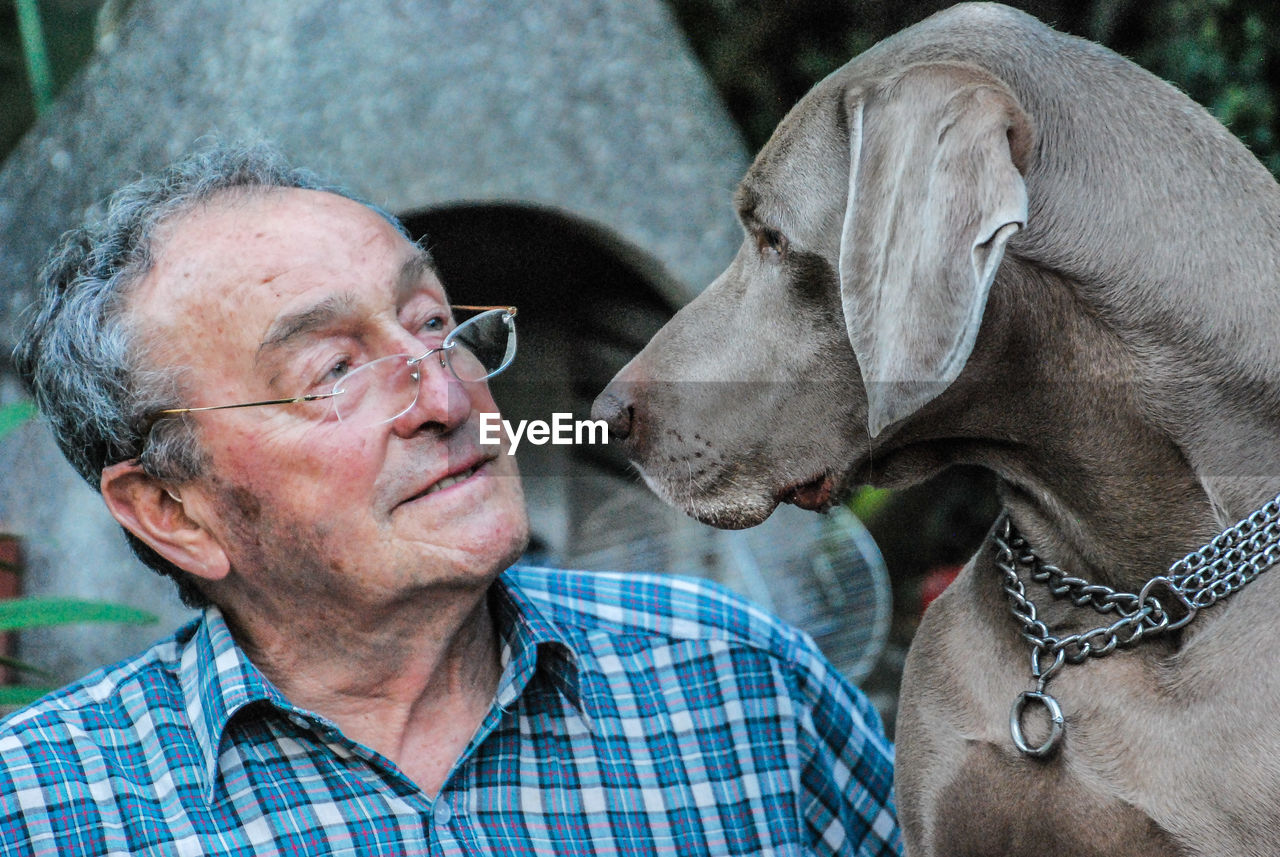 Portrait of old man and dog