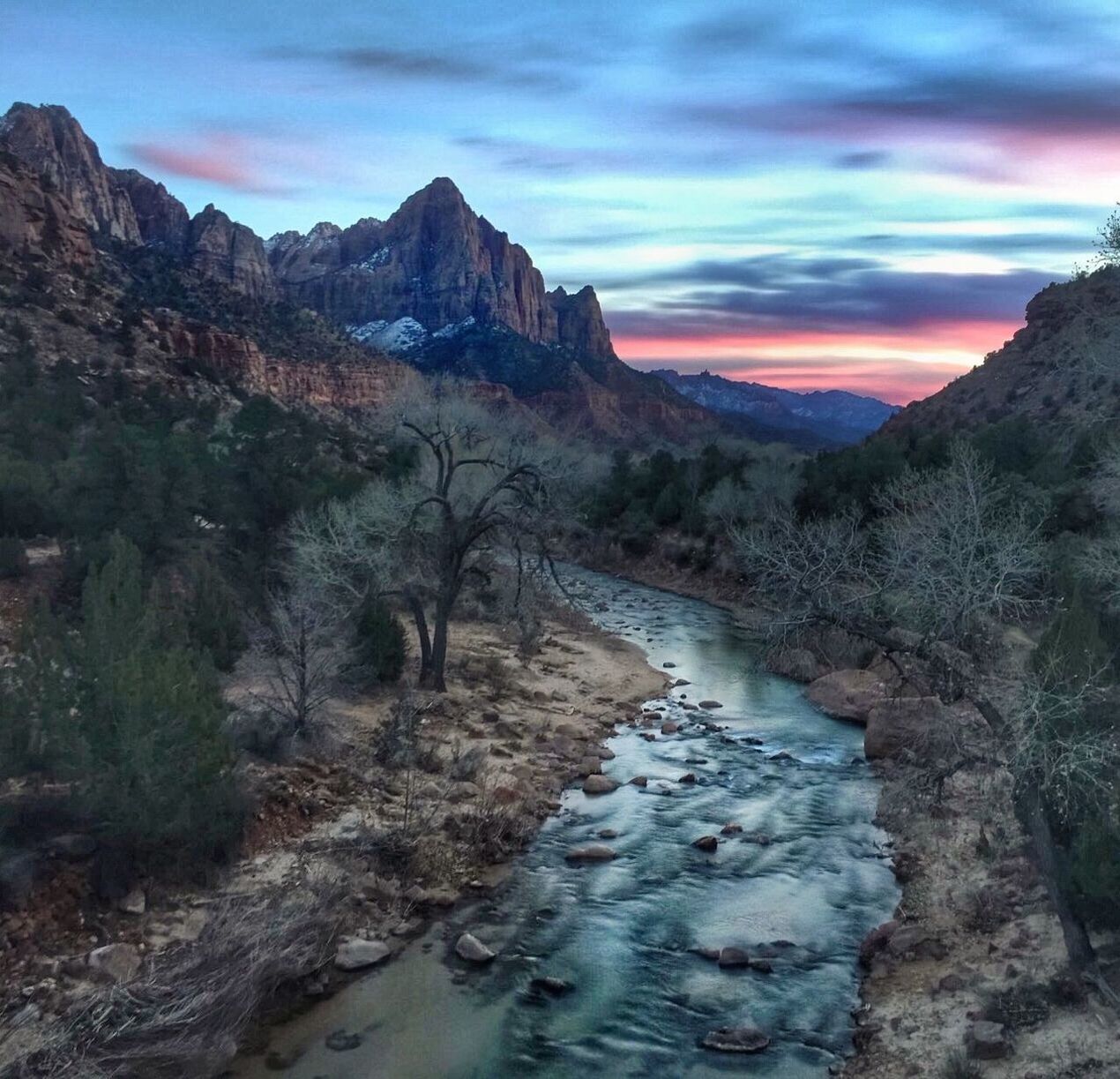 Scenic view of zion national park against sky at sunset