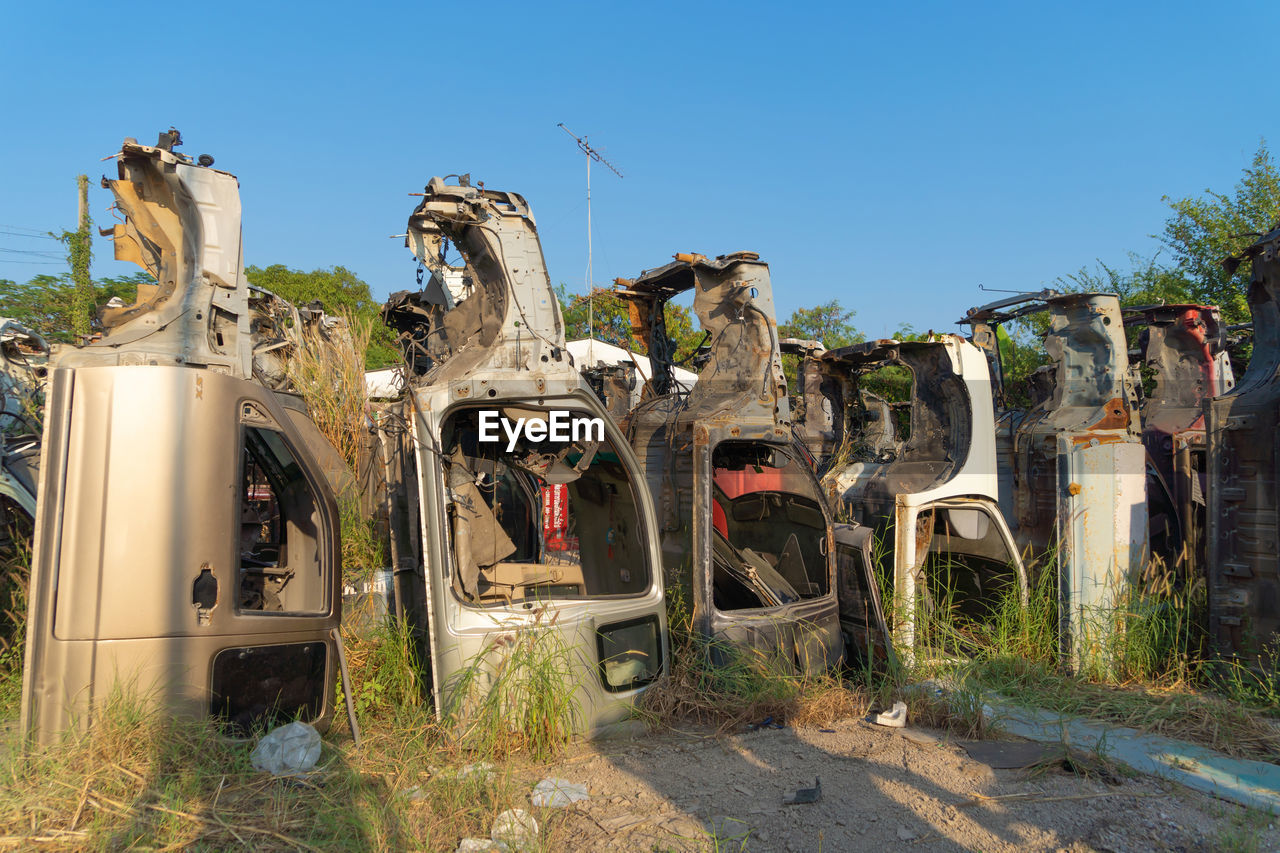 low angle view of old ruins against clear blue sky