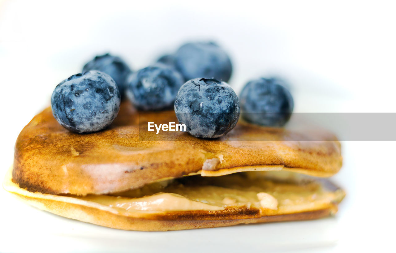 Healthy food concept displaying macro close up shot of pan cake with blueberries fruit and banana