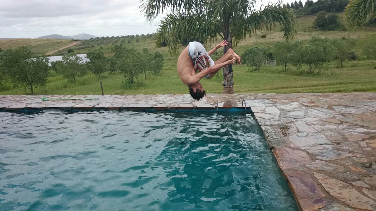 Man diving in swimming pool