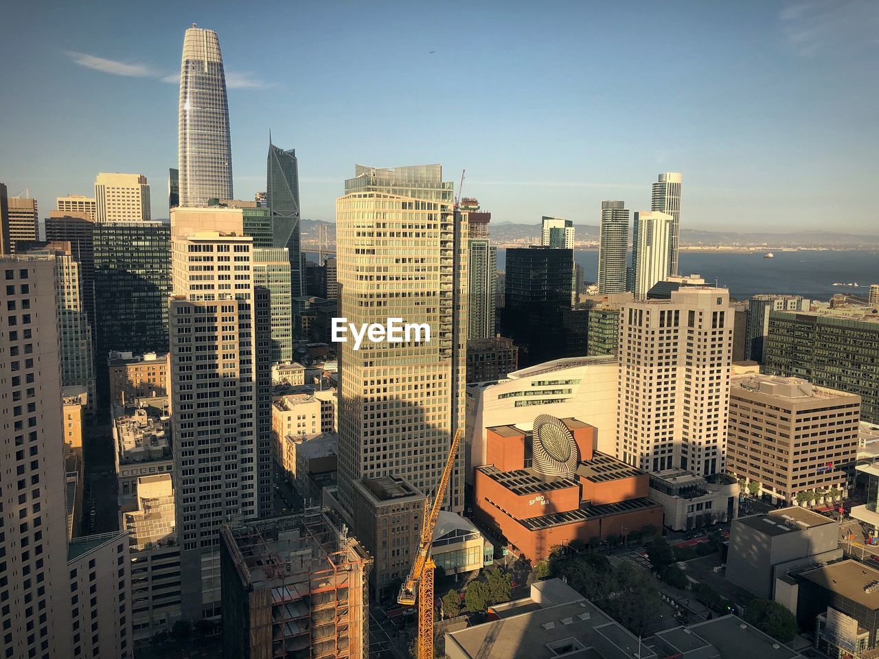 HIGH ANGLE VIEW OF MODERN BUILDINGS AGAINST SKY