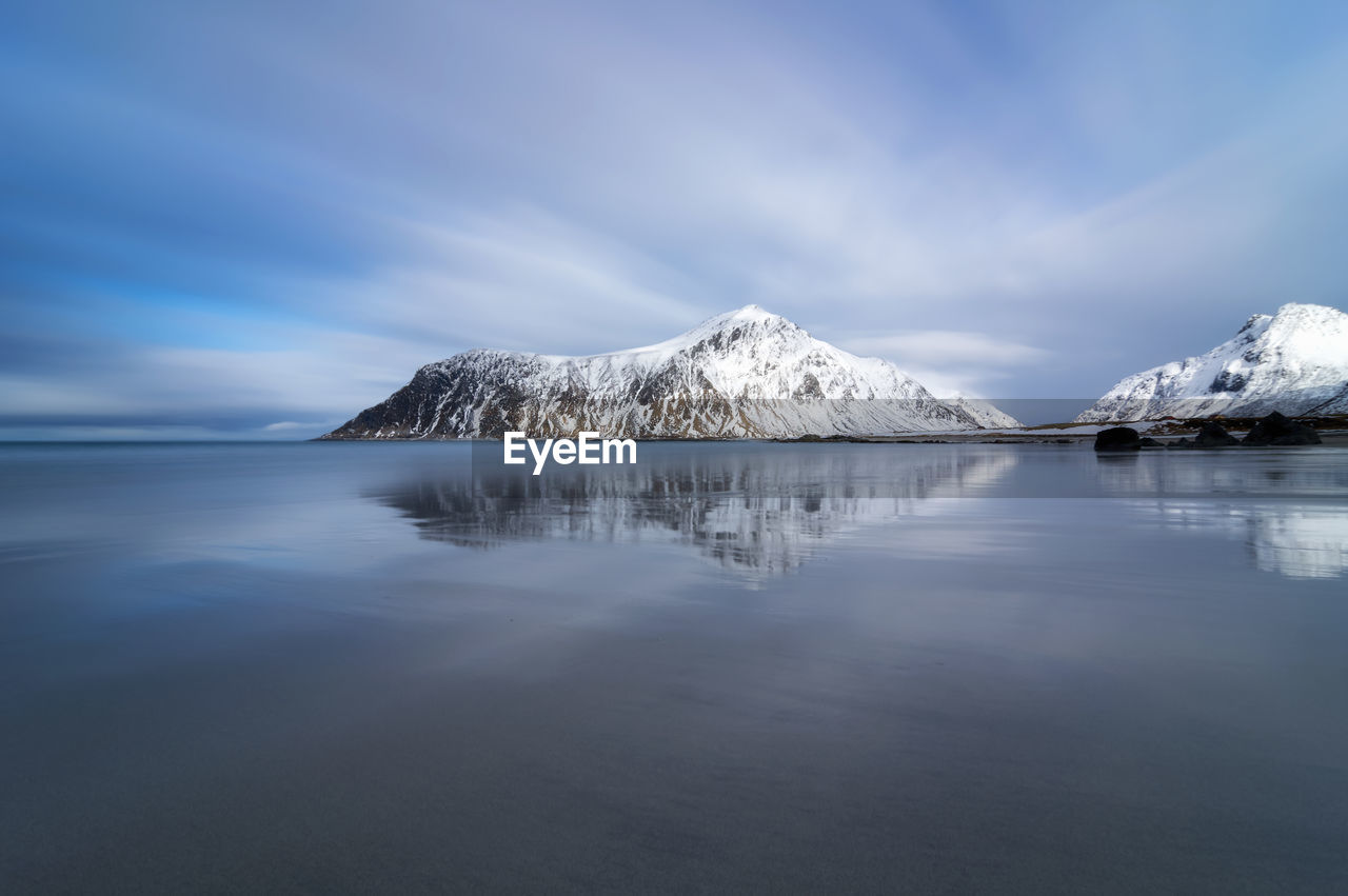 Panoramic view of sea and snowcapped mountain against sky norway