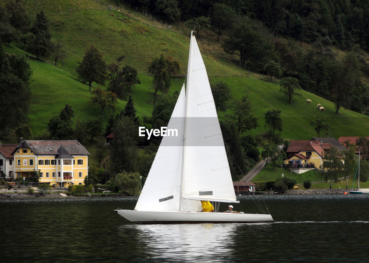 Sailing with a sailing boat on the lake, traunsee, austria
