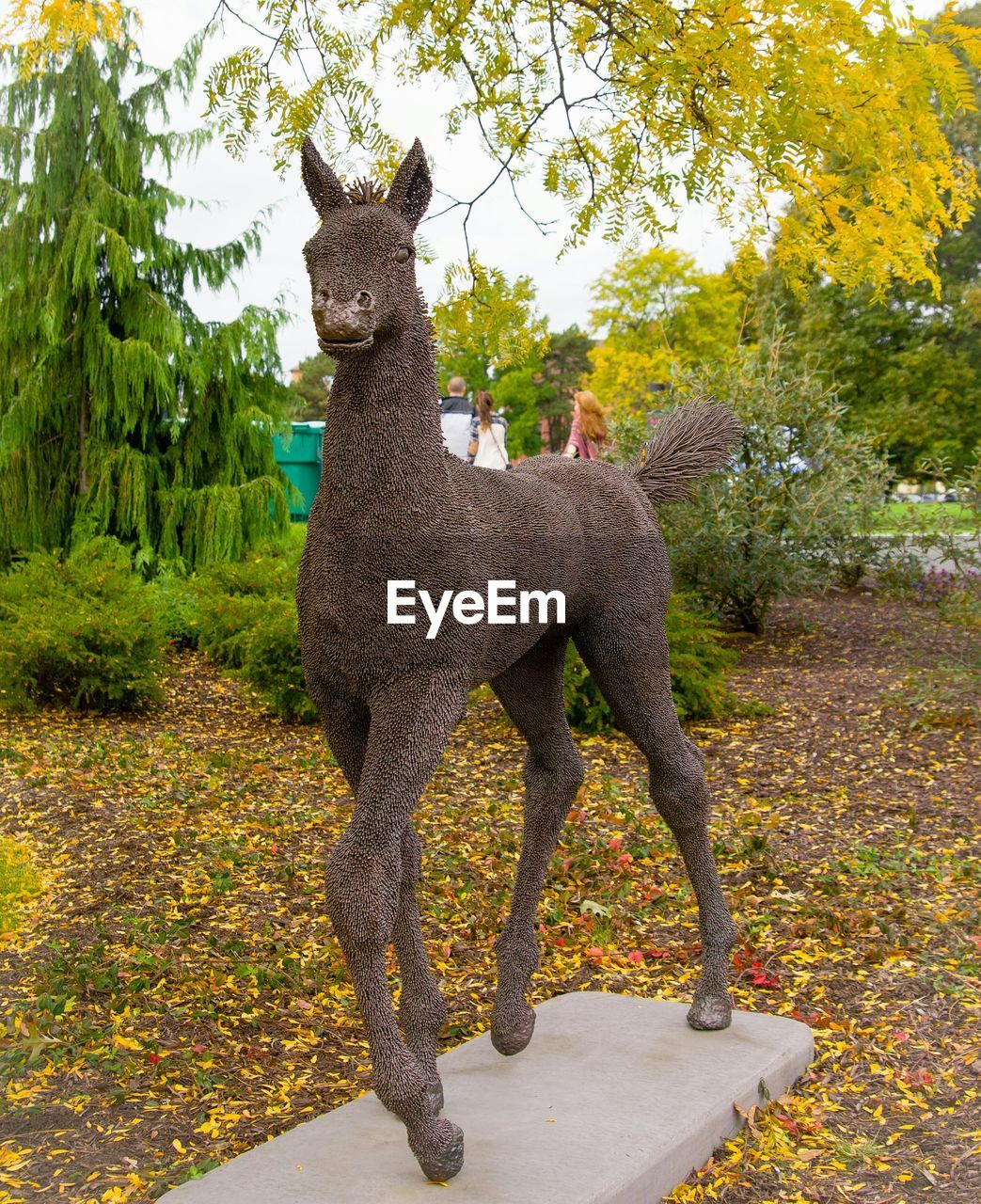 Brown animal statue in park