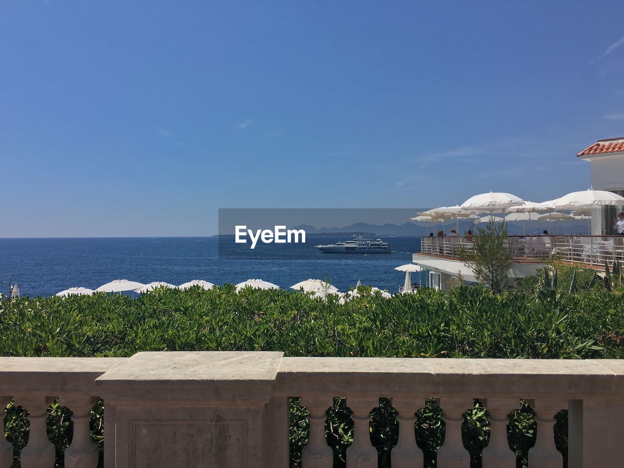 Scenic view of calm sea against clear sky