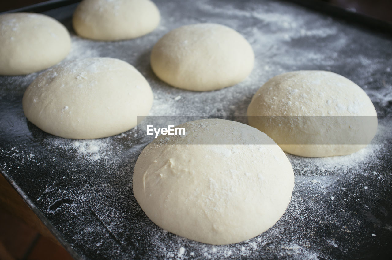 High angle view of dough in baking sheet